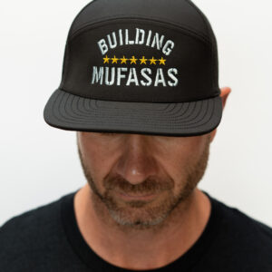 A clean black and grey structured hat featuring the Building Mufasas embroidered logo. Designed for everyday wear with a comfortable fit, this hat delivers a bold look that works for casual, work, or outdoor use.