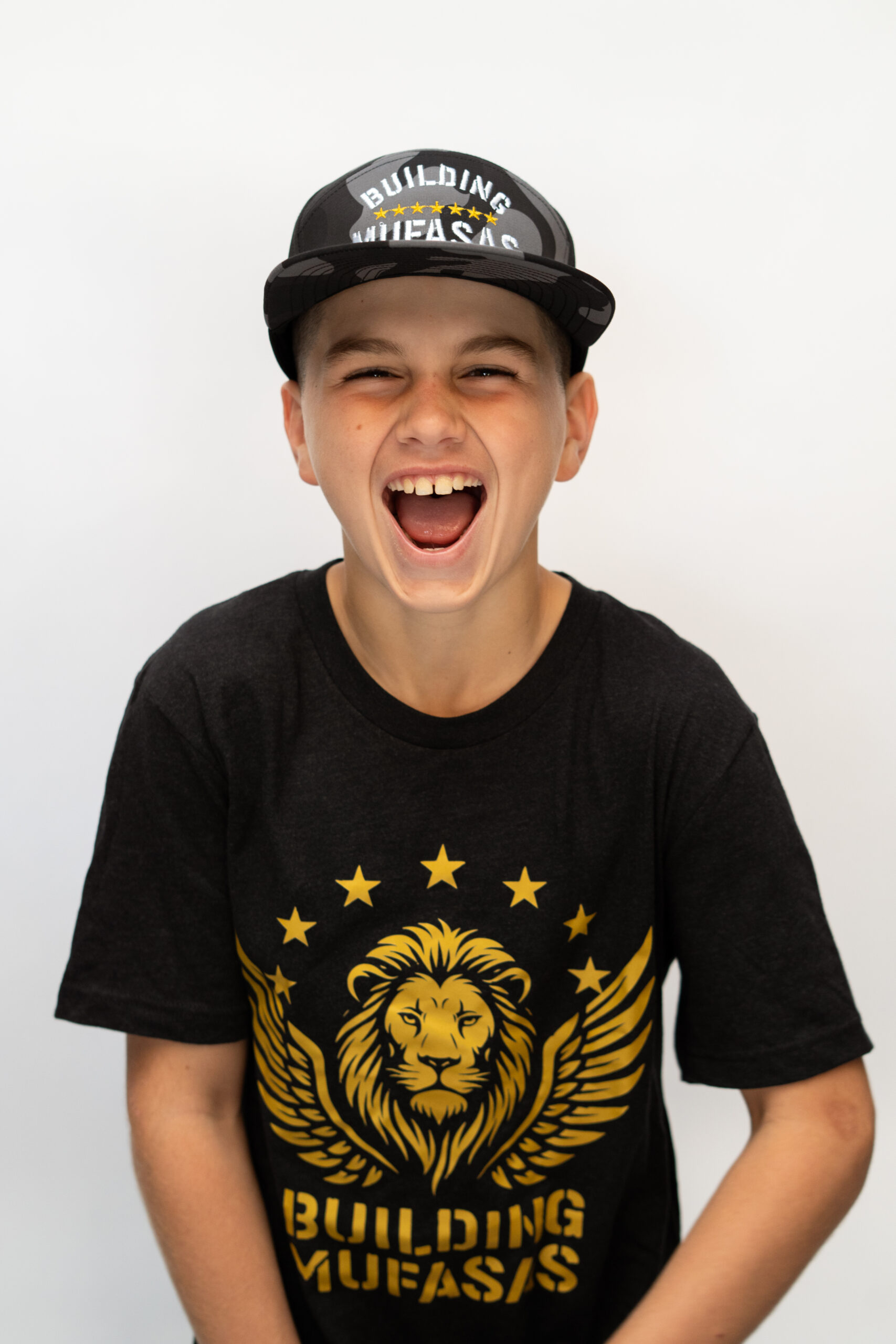 Black Building Mufasas t shirt with gold lion logo and Building Mufasas text on front zoom